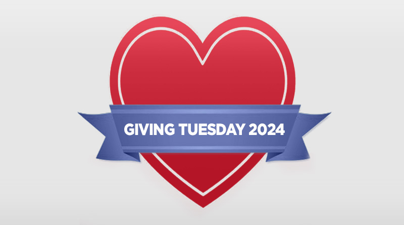 Red heart with blue ribbon that says "Giving Tuesday 2024"