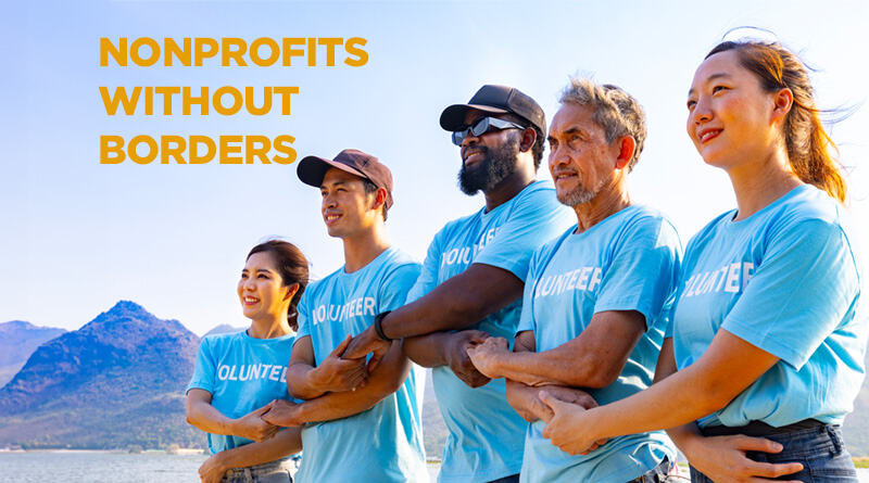 5 diverse individuals wearing volunteer shirts, linking arms in unity.