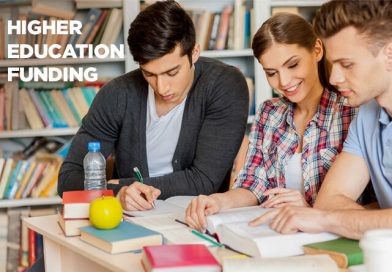 Three student gathered in a library, studying in collaboration.